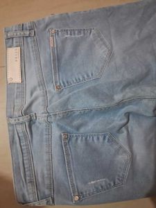 Distressed Light Wash Denim Jeans