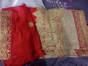 Red Heavy Saree With Golden Blouse.