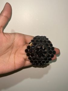 Diamond earrings with black beaded bracelet
