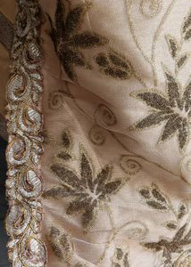 A golden mirror work on jorget suit . with neck work and sleeves fully work completed with salvar and dupatta