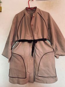 Elegant Beige Coat with Black Trim