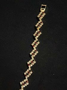 Elegant Gold Finish Bracelet with Multicolour Ston