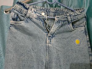 High-Waisted Denim Jeans with Daisy Embroidery.