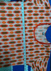 Orange colored, pure cotton women&#39;s Kurti