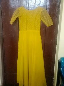 Beautiful Mustard Gown With Netted Layer
