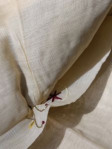 Cream Saree With Unique Pipe And Pearl Work