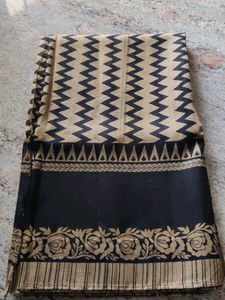 Elegant Black & Gold Print Saree