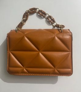 Quilted Orange Sling Bag With A Chain