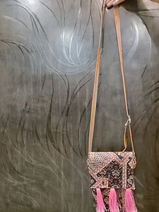 Vibrant Multicolored Sling Bag with Pink Tassels