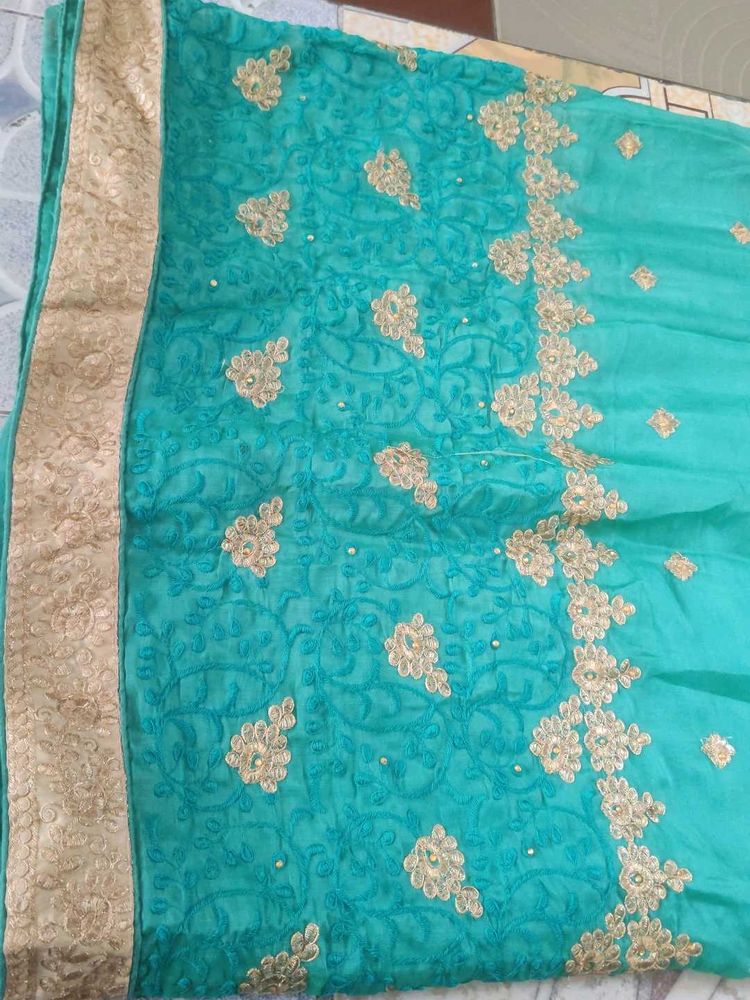 Elegant Teal Embroidered Saree
