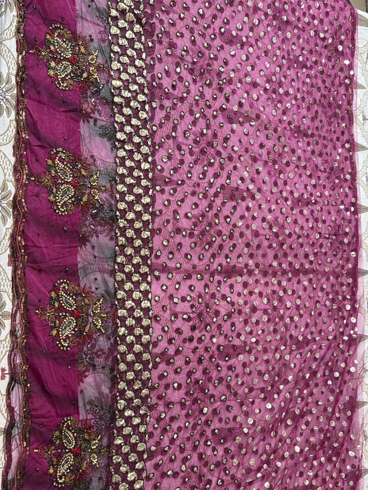 Heavy Purple Stone And Sequin Work Net Saree