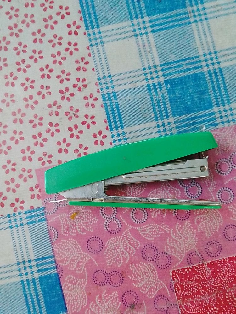 Stapler with pin remover