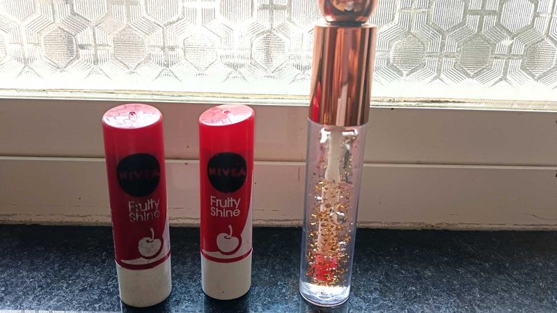 2 nivea cherry lipbalm and 1 glitter lip gloss