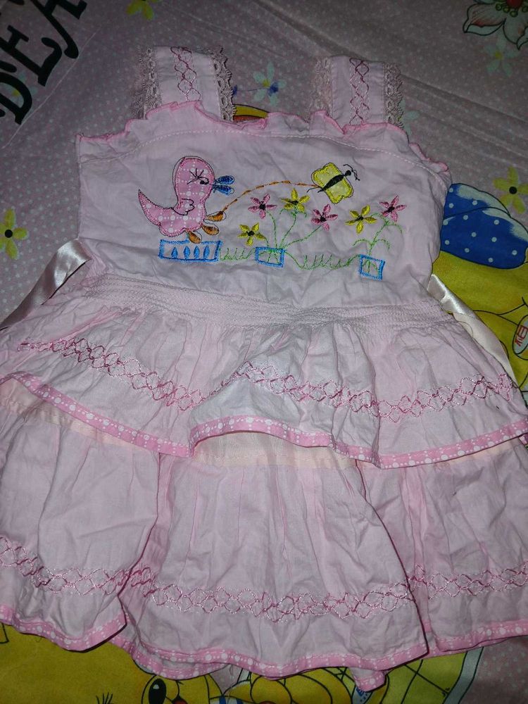 two baby girl dresses are there