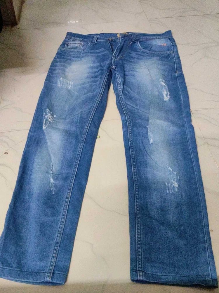 Distressed Blue Denim Jeans