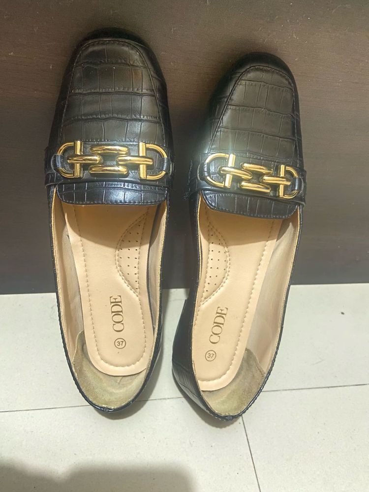 Black Loafers with Gold Detail