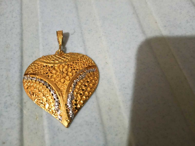 Gold Tone Pendant With Intricate Woven Texture