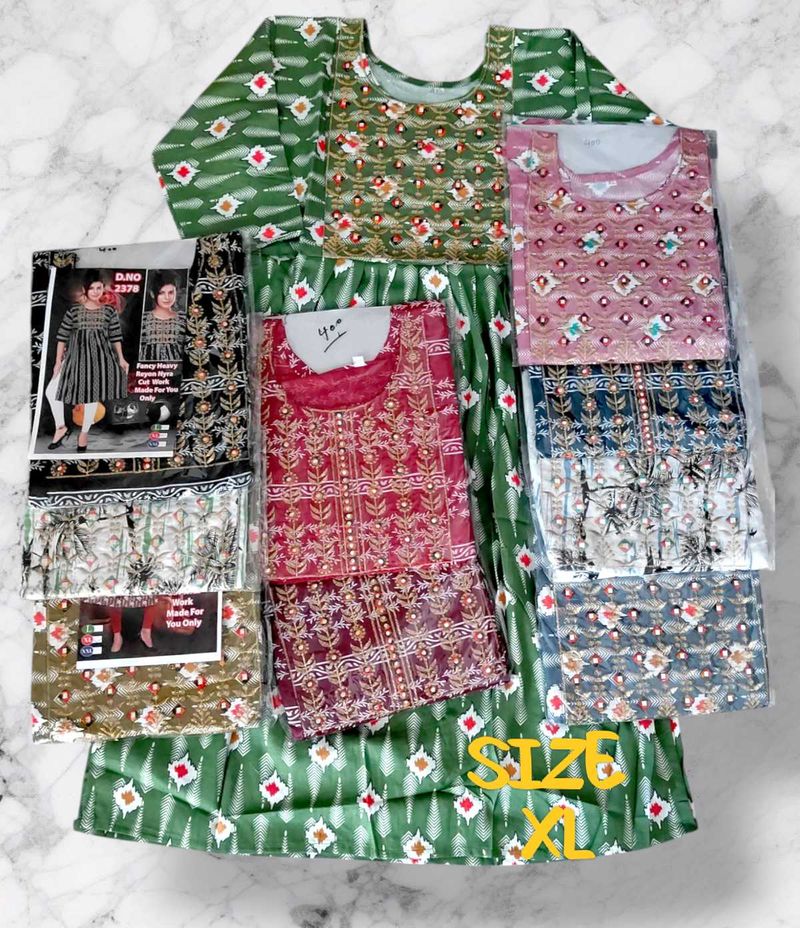 FANCY HEAVY REYON NAYRA CUT KURTI