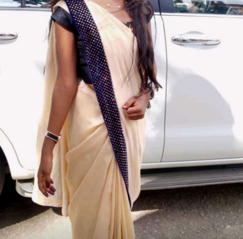 Elegant Beige Saree with grand blue border