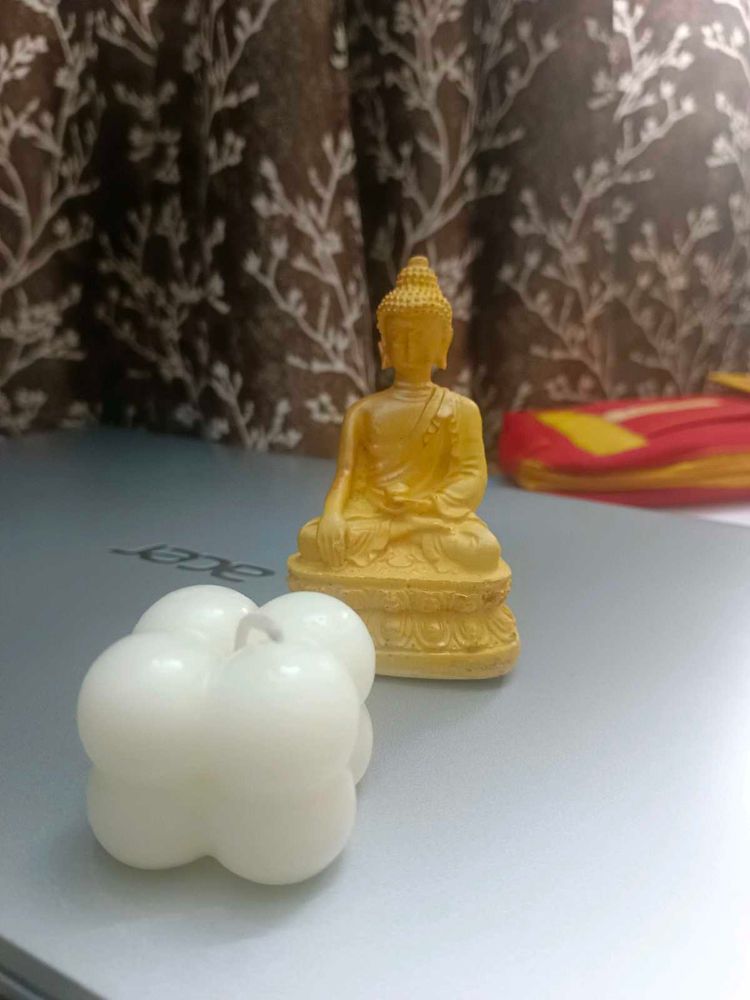 Buddha Idol And Bubble Candle