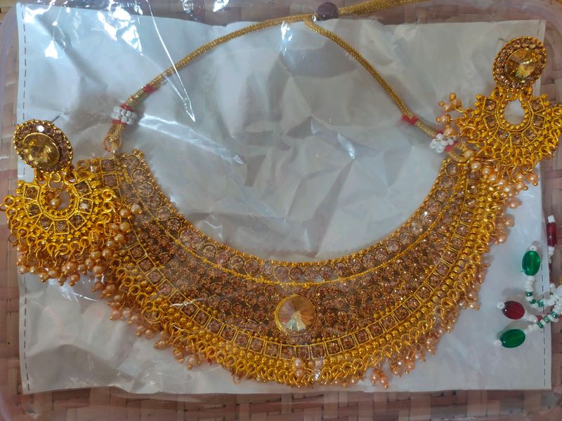 golden neck piece with earings/ stone work