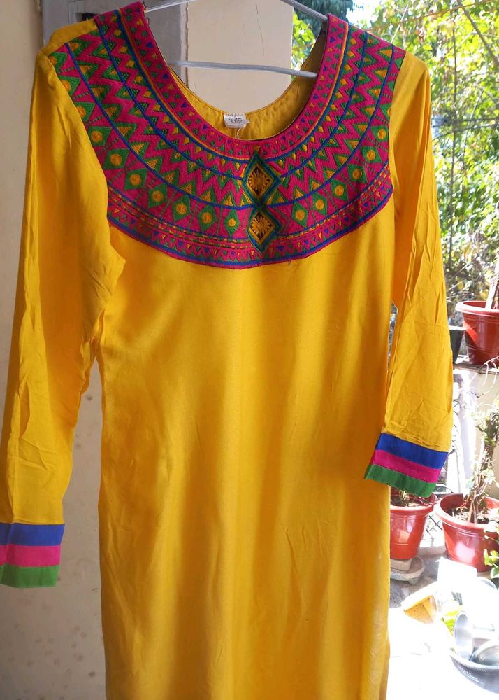 Yellow Kurti With Multicolor Embroidered Yoke