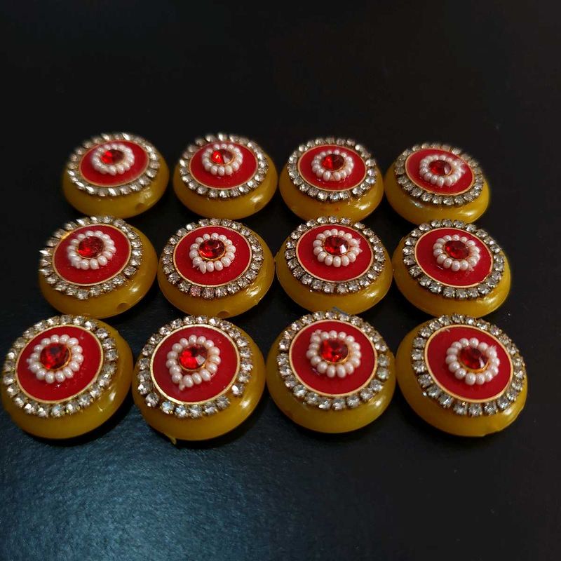 yellow and red diamond embellishment