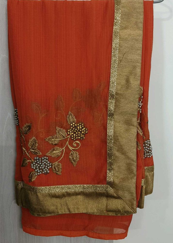 Elegant Orange Embroidered Saree