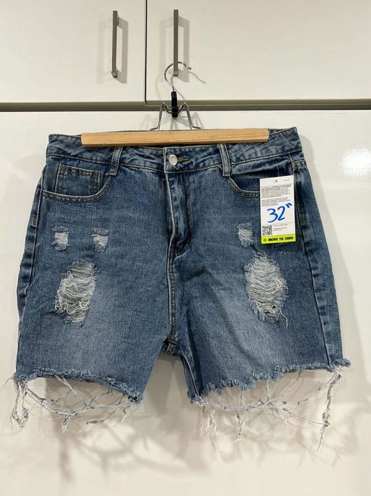 Blue ripped shorts