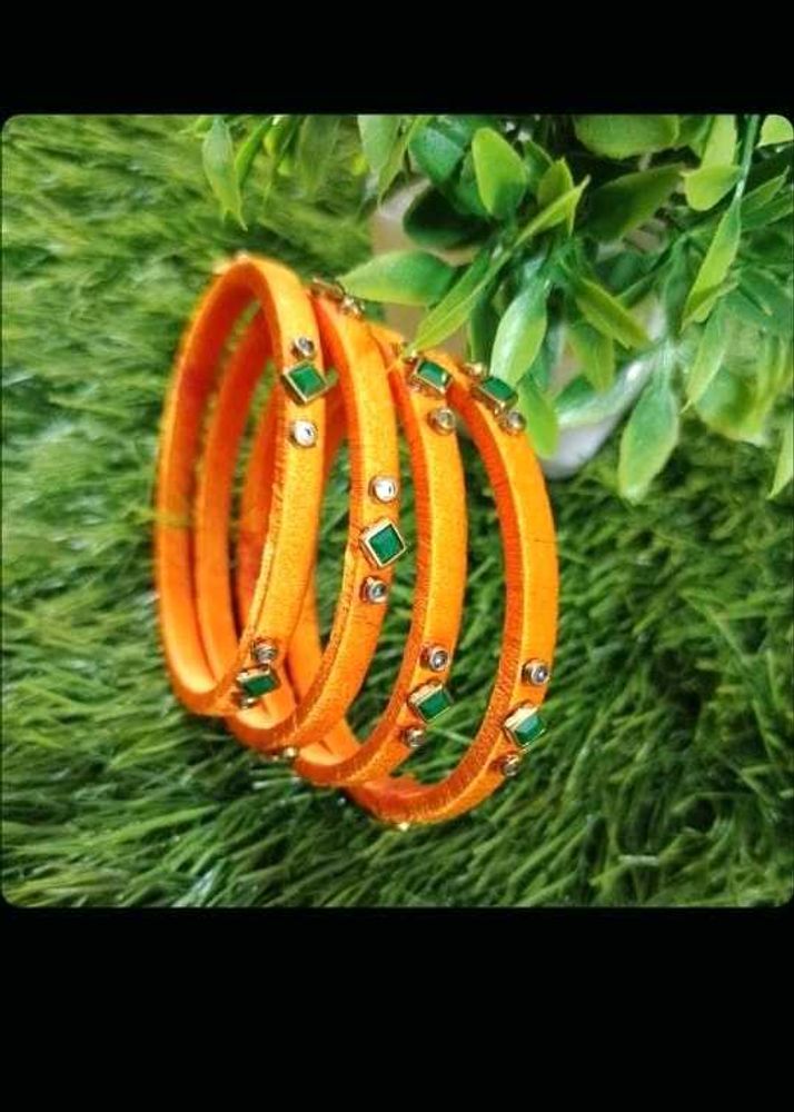 Orange Bangles with Green and White Stones