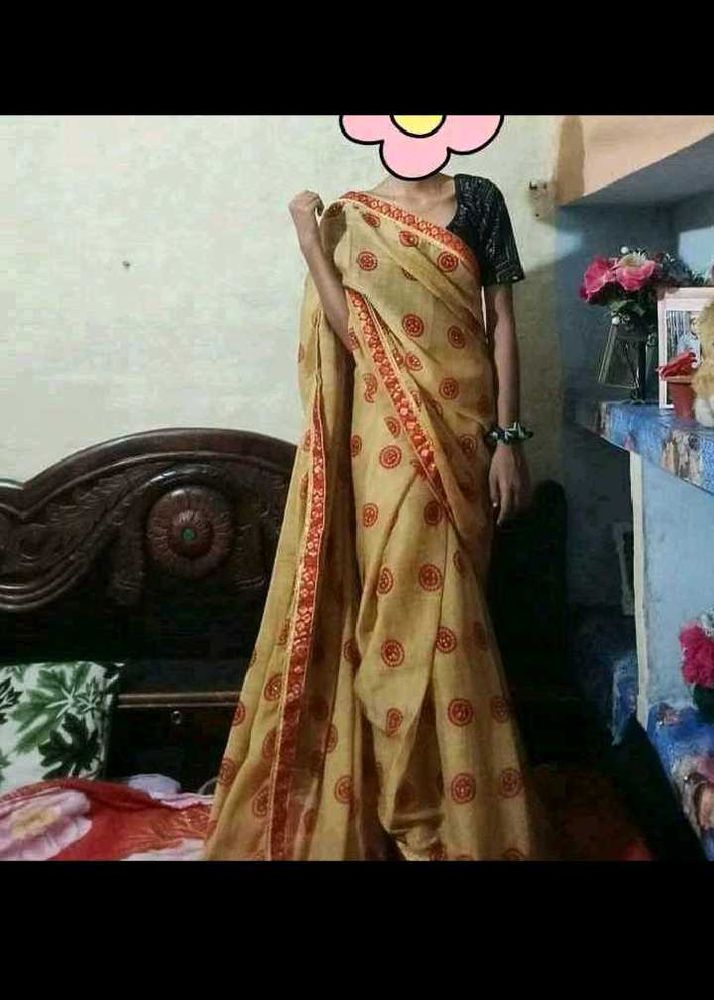 Elegant Beige Saree with Red Accents