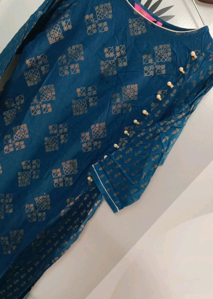 Tail Blue Colour Kurti With Beautiful Golden Pattern