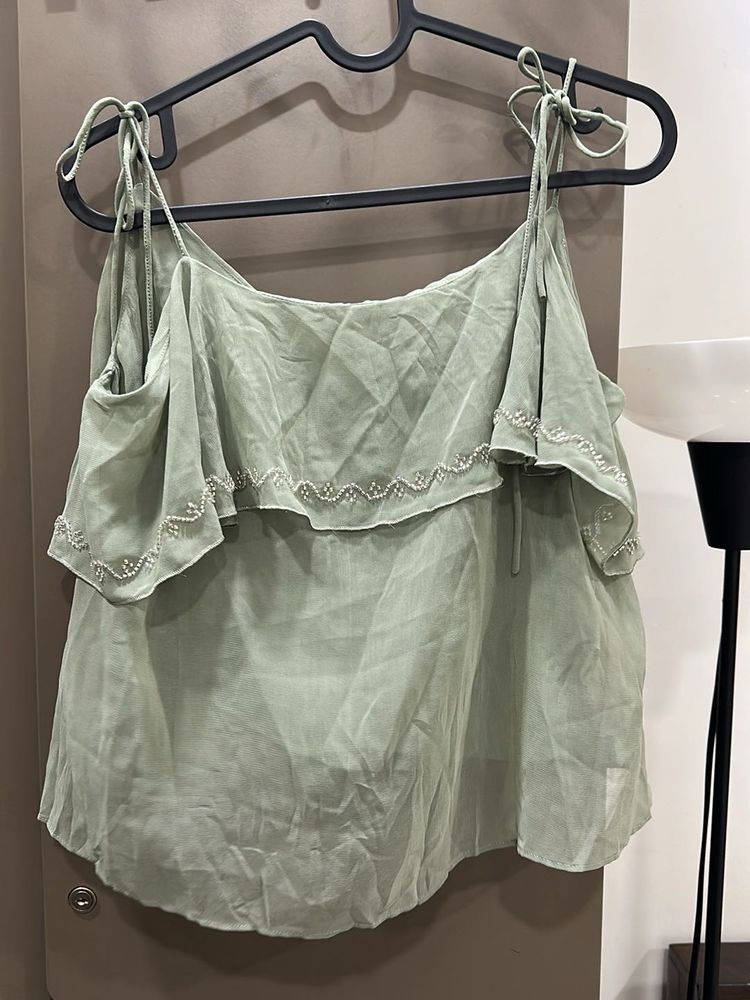 A teal sequinned top perfect for parties