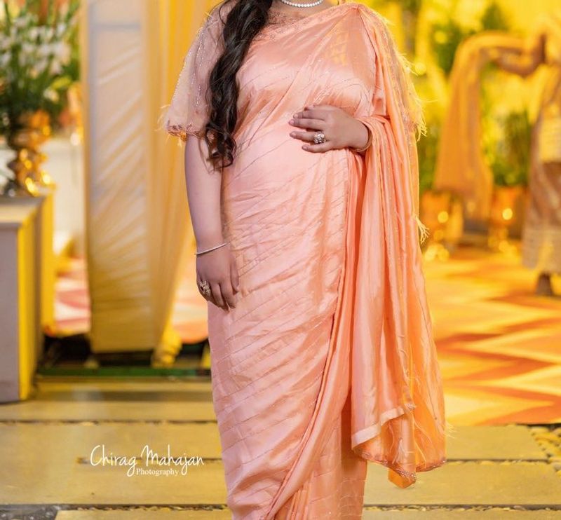 Beautiful Peach Saree with Feather Detail