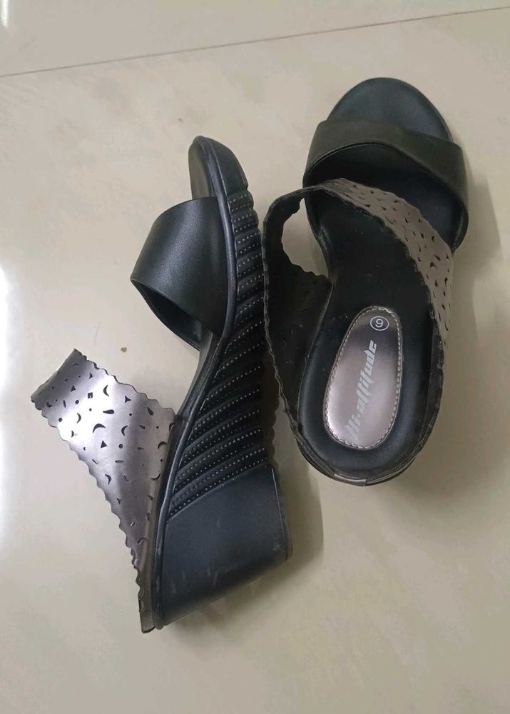 Black hi-attitude wedge Heels