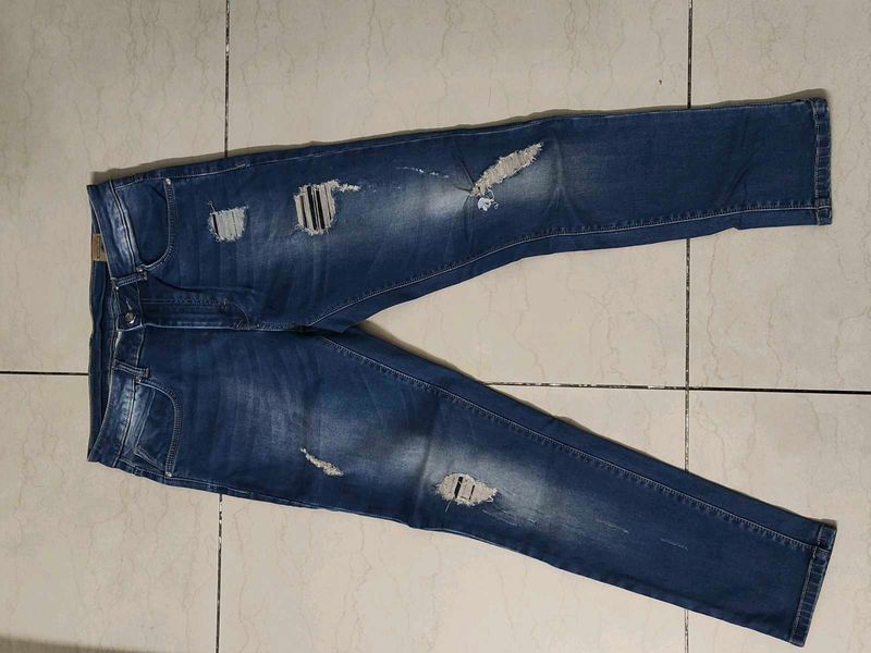 Ripped Blue Denim Jeans