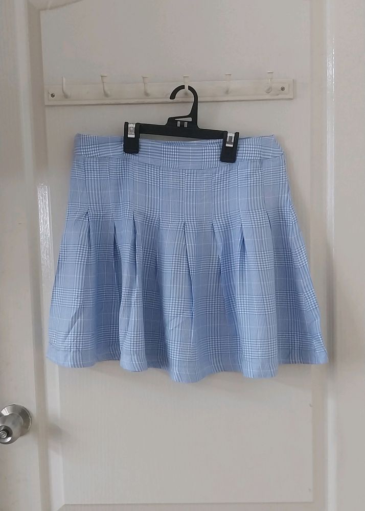 AND blue checkered skirt.