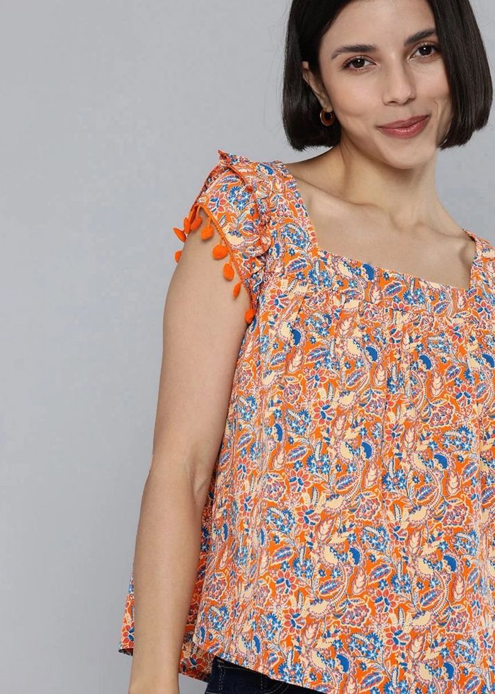 Printed Orange Top with Pom-Poms