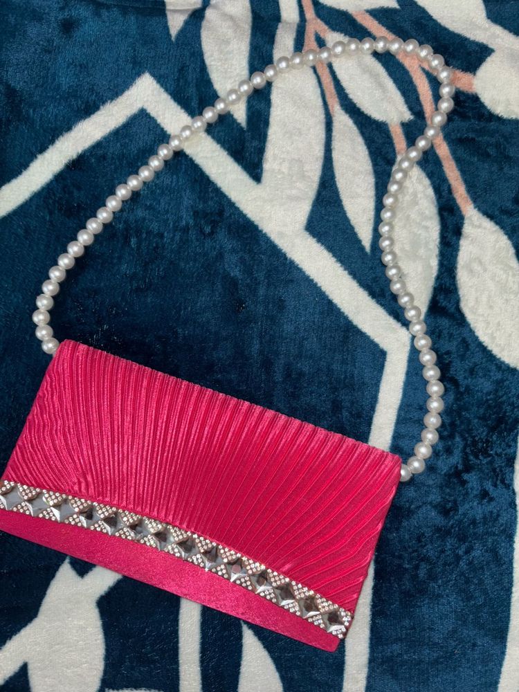Elegant Pink Clutch with Pearl Strap