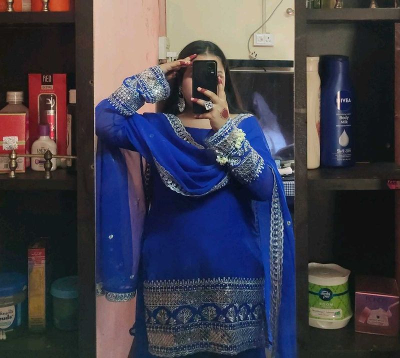 Royal Blue Embroidered sharara suit with dupatta.