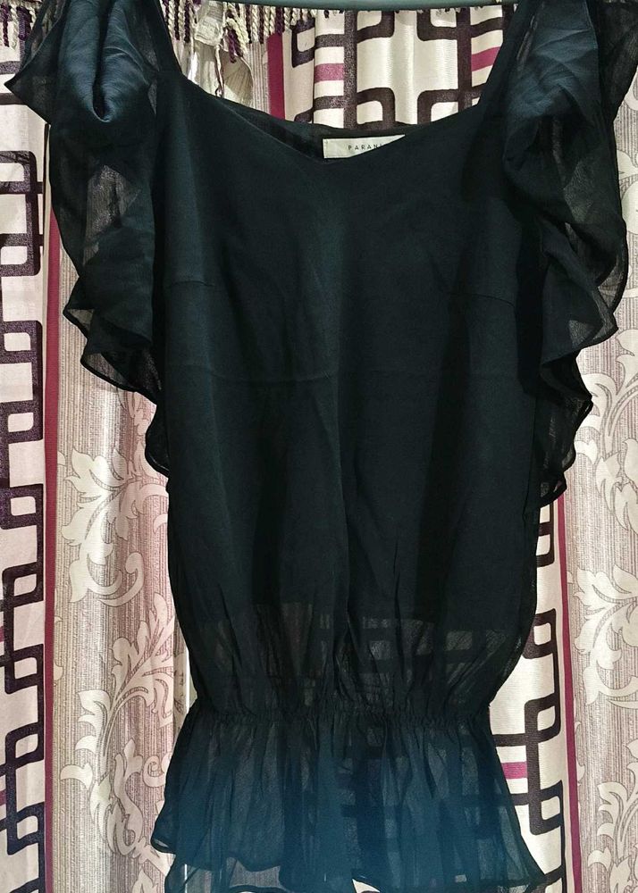The perfect black top, elevated.