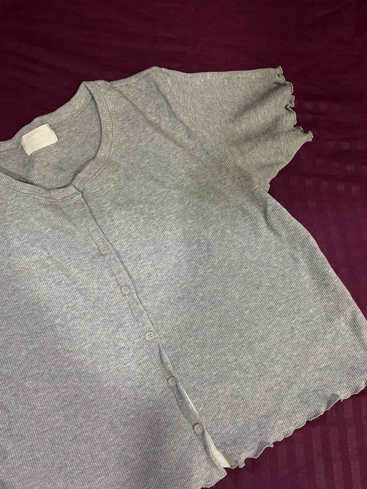 grey button top