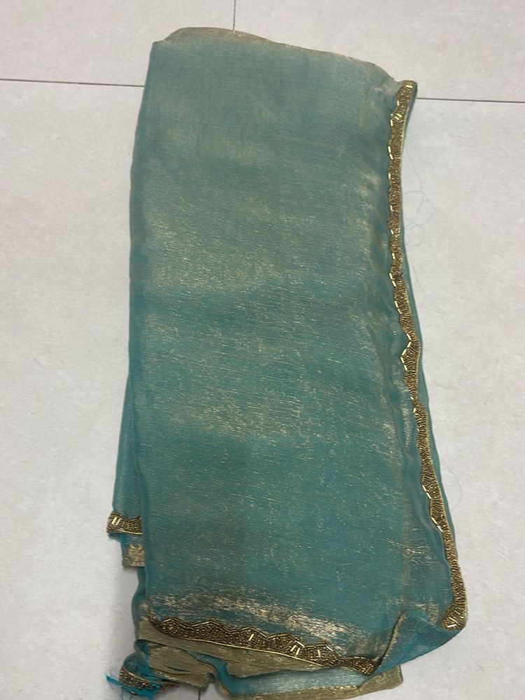 Elegant Teal Saree with Gold Details