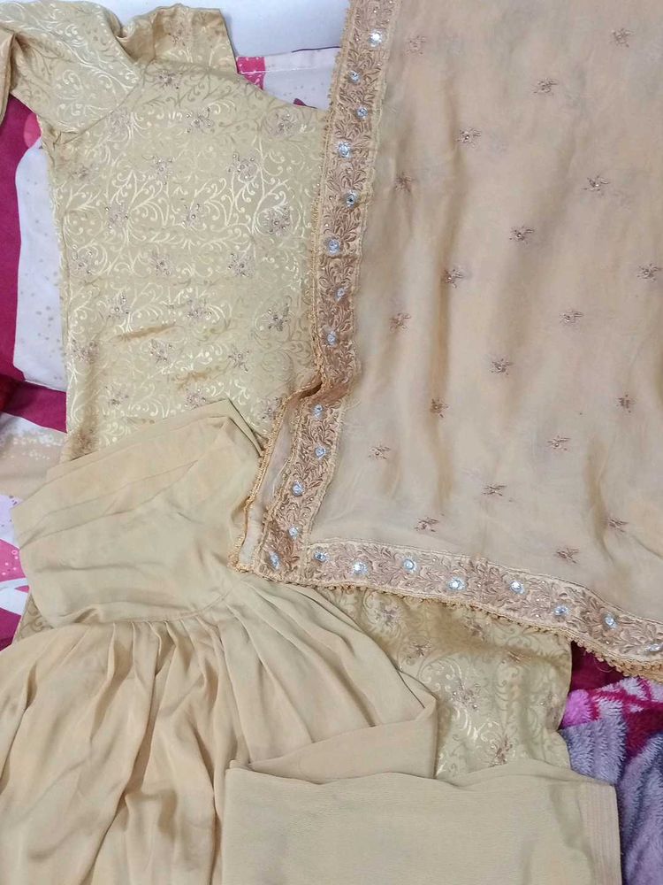 Elegant golden colour Indian suit