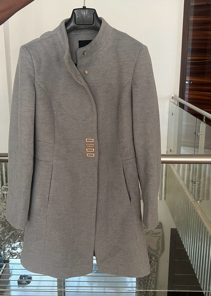 madame’s ice blue overcoat