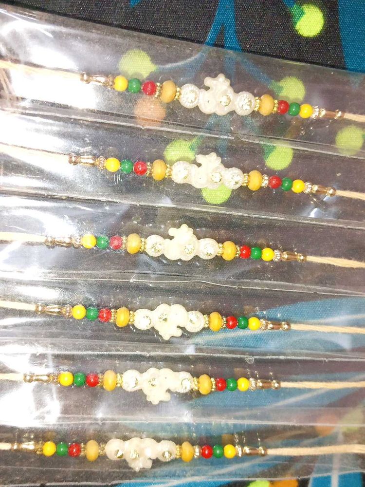 Beaded Rakhi Set Of 12 Peace