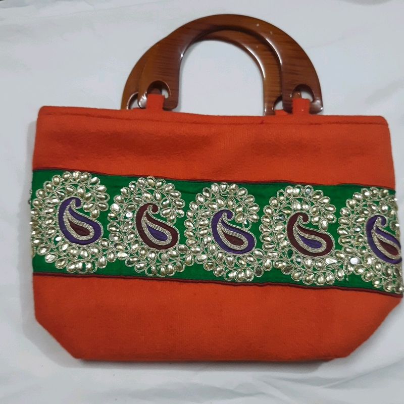 handcrafted purse with kundan work