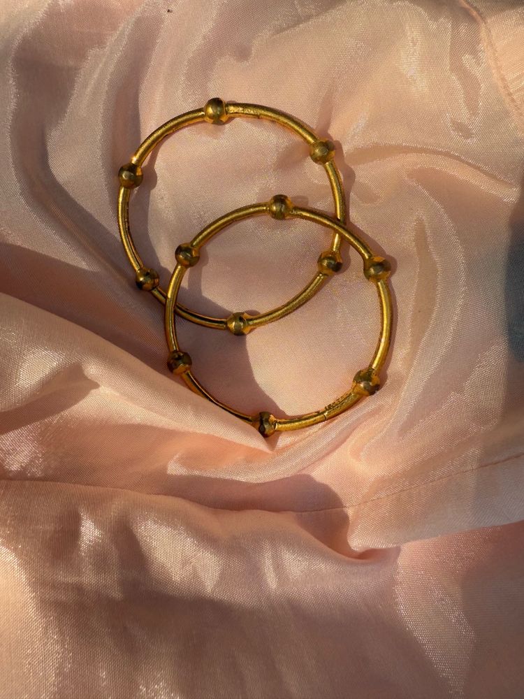 pair of gold bangles