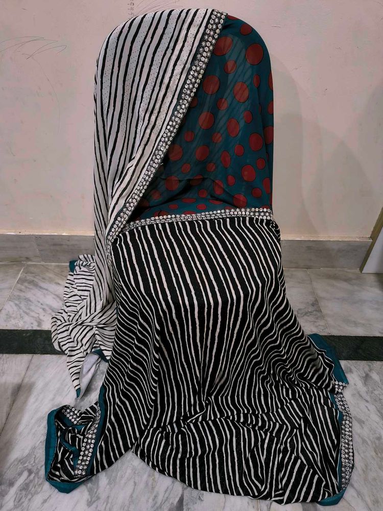 Green,red,black and white standard saree.