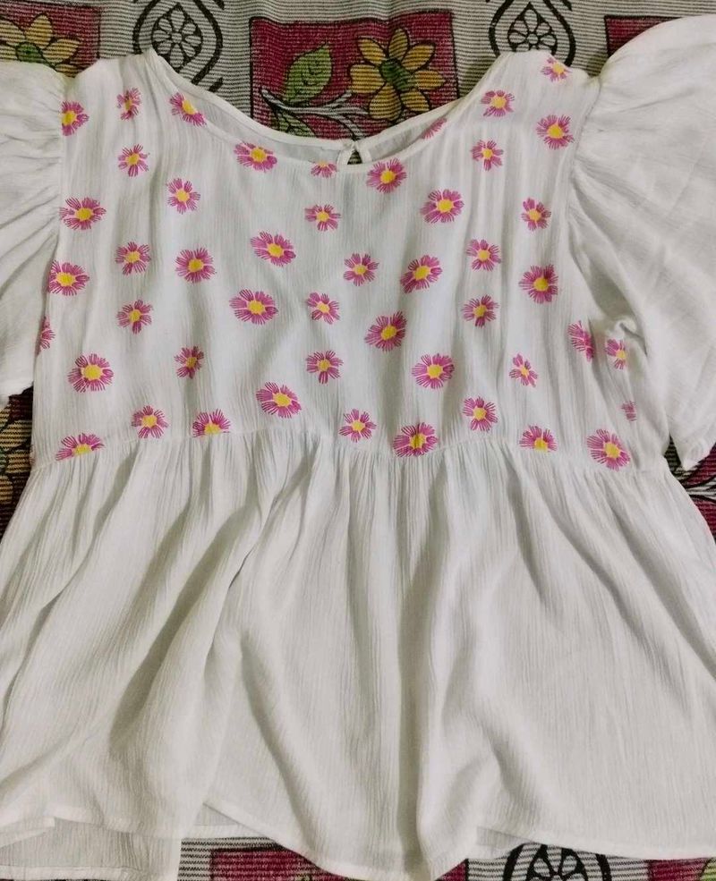Daisy Embroidered Peplum Top